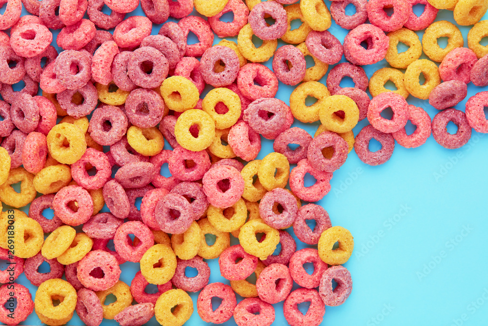 Colorful cereal rings corn flakes on blue background with copy space. Flay  lay overhead view Stock-Foto | Adobe Stock