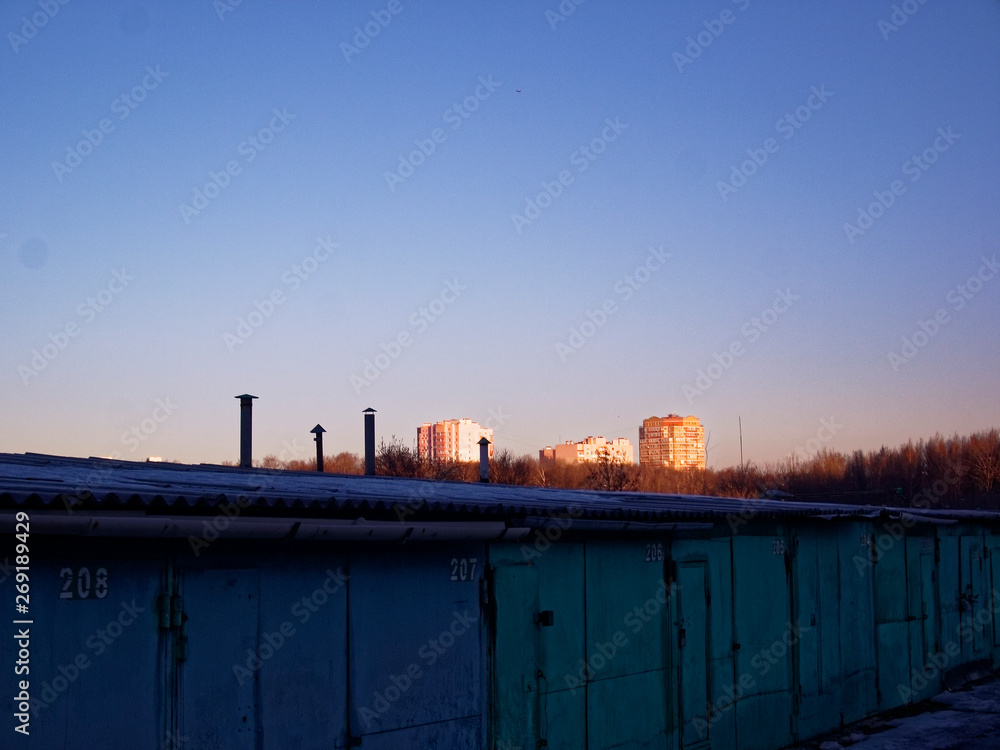 car garages in winter on a clear day car garages in winter on a clear day