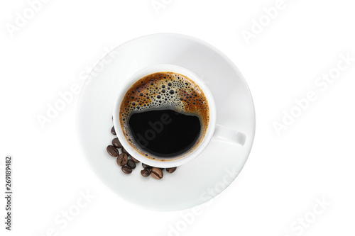 Cup of coffee with coffee beans isolated on white background, top view. Coffee time accessories