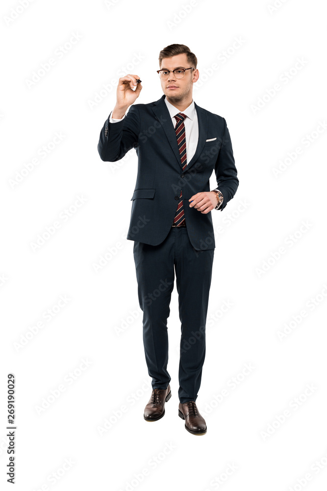 handsome businessman holding marker pen while standing isolated on white handsome businessman holding marker pen while standing isolated on white