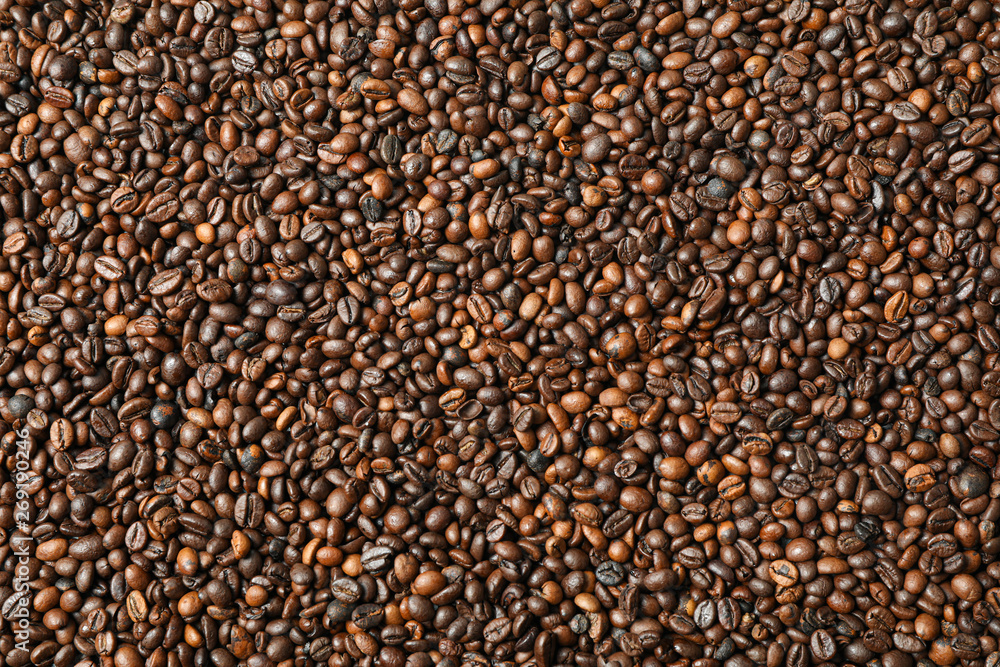 Many coffee beans as background, top view and space for text Many coffee beans as background, top view and space for text