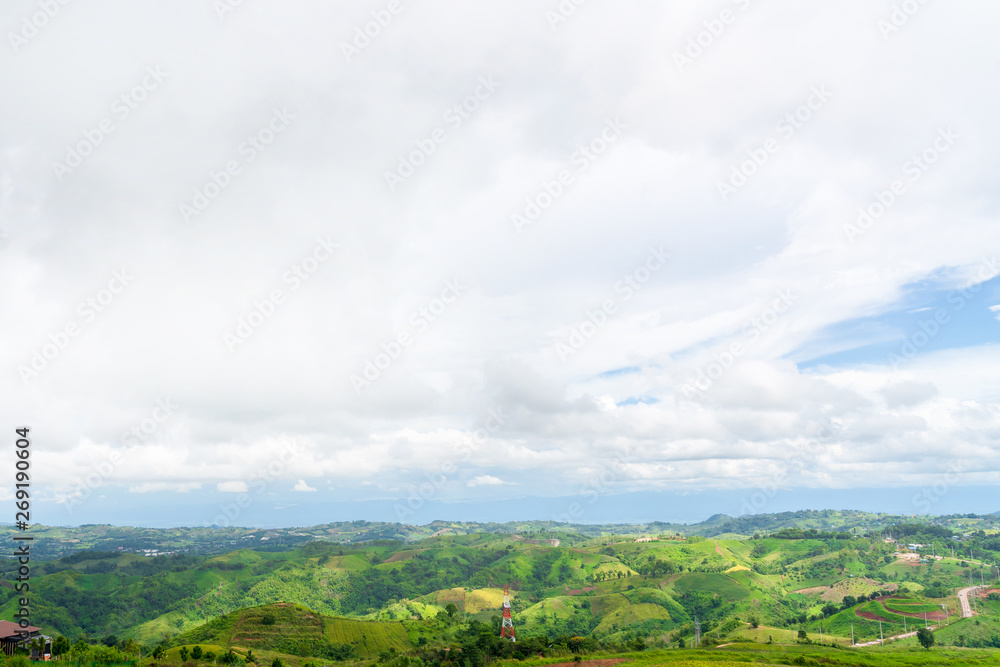 Obraz premium Blue sky high peak mountains fog hills mist scenery national park views at Phu Tub Berk, Khao Koh, Phetchabun Province, Thailand