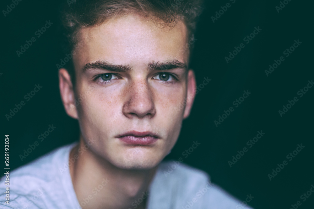 Fototapeta premium Handsome young man teenager , isolated, black background