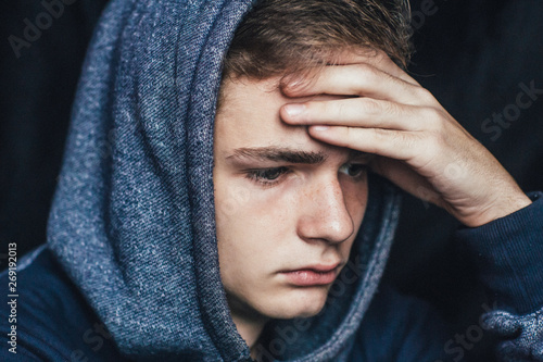 Portrait of a sad, tired, depressed teenager. Problems of teenagers, concept