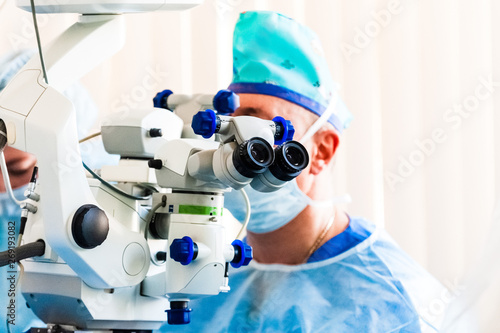 The doctor - the ophthalmologist does operation in the operating