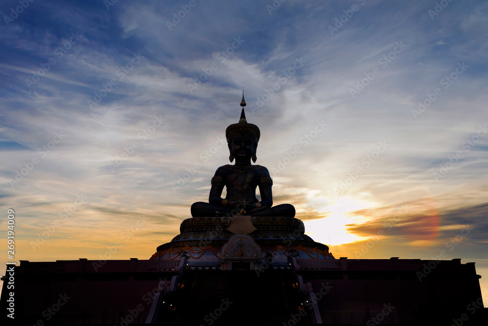 Silhouette of buddha statue at Thai temple on sunset background, Southeast Asia. Silhouette of buddha statue at Thai temple on sunset background, Southeast Asia.