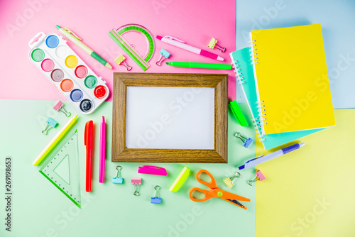 Colorful back to school background. Bright background with school supplies, stationery, pens, pencils, rulers, notebooks, copy space for text, whiteboard for notes, flat lay top view