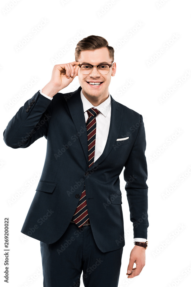 cheerful businessman in suit touching glasses isolated on white cheerful businessman in suit touching glasses isolated on white