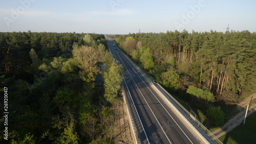 View from the height of the green forest and the road