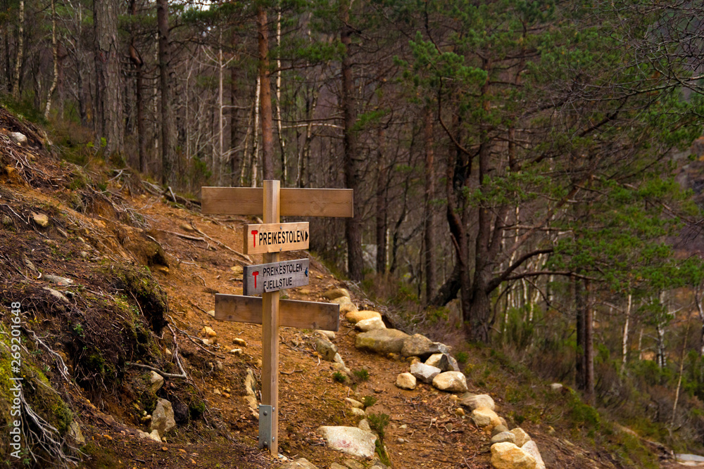 Signposts Rock Signpost showing direction and distance to Preikestolen, or Pulpit Rock ...