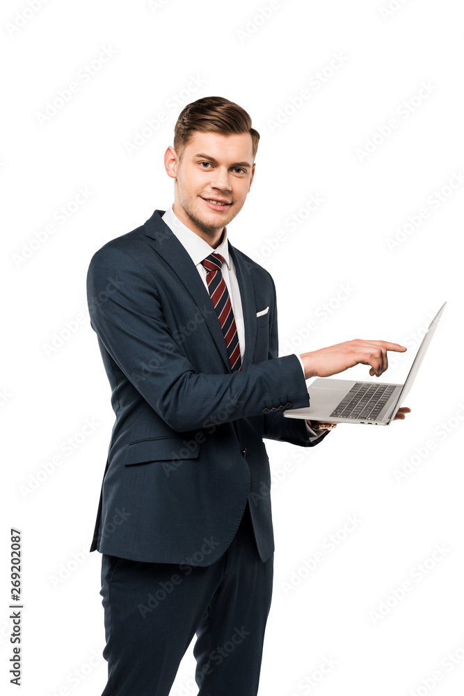 happy businessman pointing with finger at laptop while standing isolated on white happy businessman pointing with finger at laptop while standing isolated on white