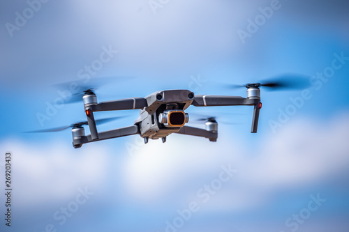 Drone with high resolution digital camera on the sky. Weather is cloudy
