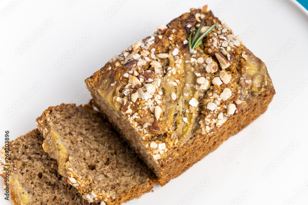 Almond bread loaf with Almond diced and Banana sliced set on Blue Background. Almond bread loaf with Almond diced and Banana sliced set on Blue Background.