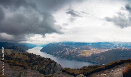 Panoramic view of foggy landscape of rocky mountains and Lysefjord in Preikestolen, Stavanger, Norway.