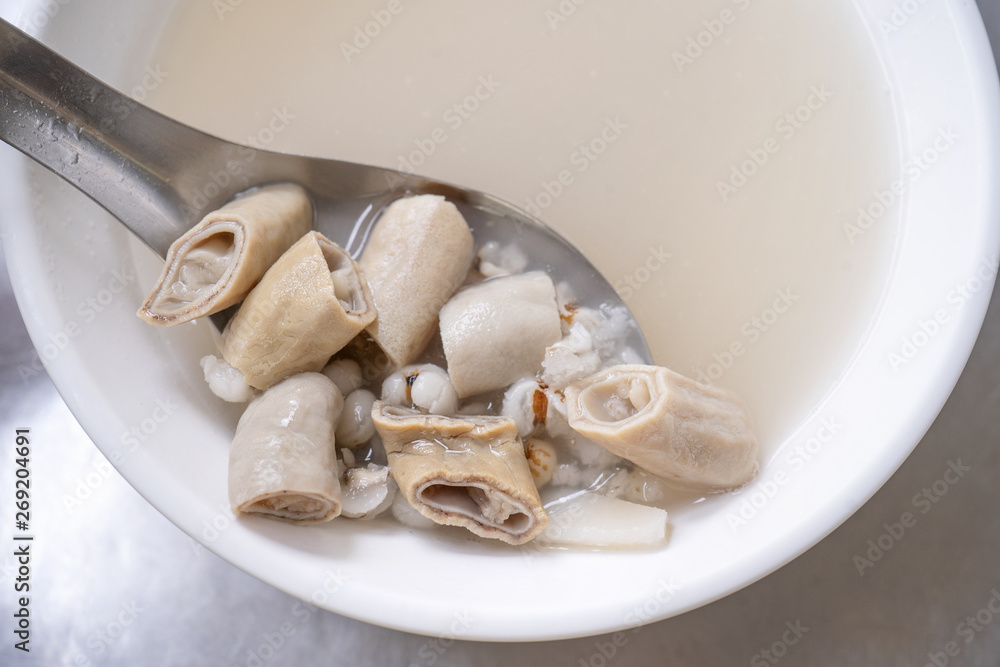 Four tonics soup, four ingredients herb flavor soup. Taiwanese delicious street food delicacy with Job's tears, pork intestines, close up, copy space