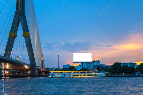 Photography Dinner cruise on the river next the bridge with sunset sky.