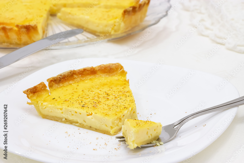 Sweet custard tart or lemon pie white background. Selective focus. Close up. Sweet custard tart or lemon pie white background. Selective focus. Close up.