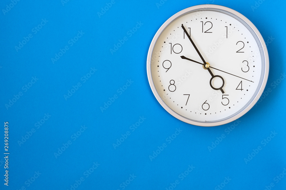 Clock on a blue wall Clock on a blue wall