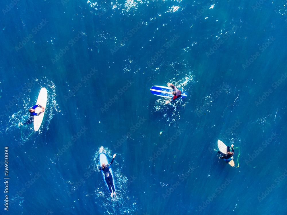 Group of novice surfers are learning to embark on wave. Aerial top view Group of novice surfers are learning to embark on wave. Aerial top view