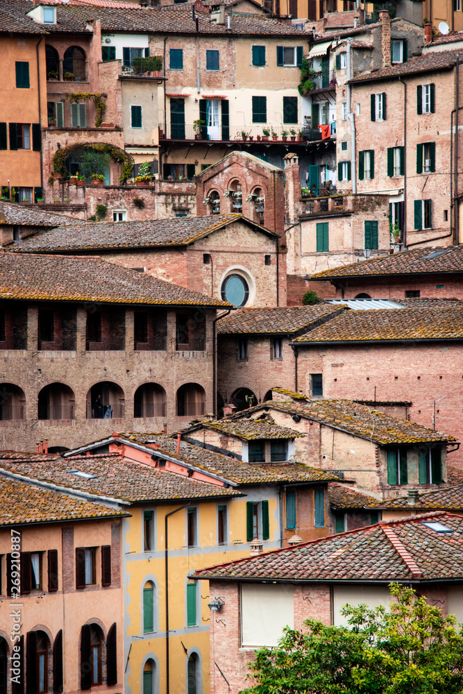 Crowd of ancient houses. Siena, Tuscany, Italy.