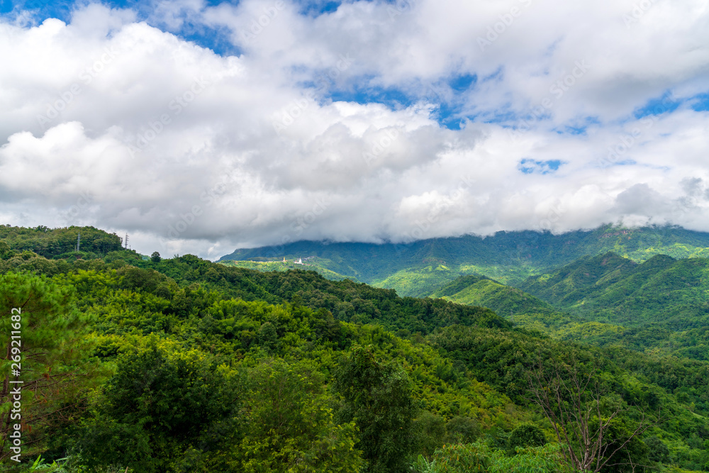 Naklejka premium Blue sky high peak mountains fog hills mist scenery national park views at Phu Tub Berk, Khao Koh, Phetchabun Province, Thailand