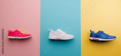 A studio shot of running shoes on bright color background. Flat lay. photo