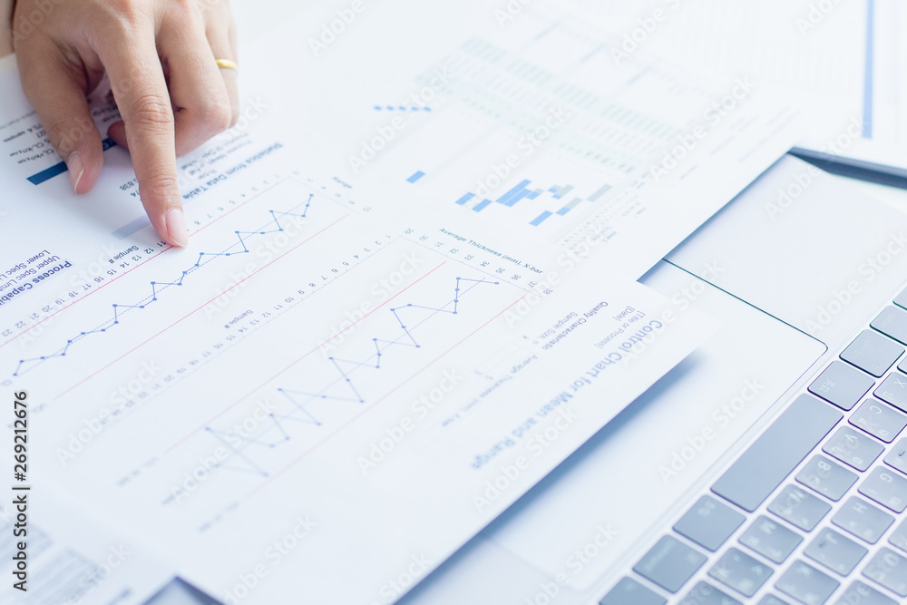 Businessman or Manager work with financial paper report, business planing and analysis of growth concept. Businessman or Manager work with financial paper report, business planing and analysis of growth concept.