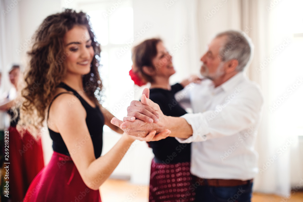 Group of senior people in dancing class with dance teacher. Group of senior people in dancing class with dance teacher.