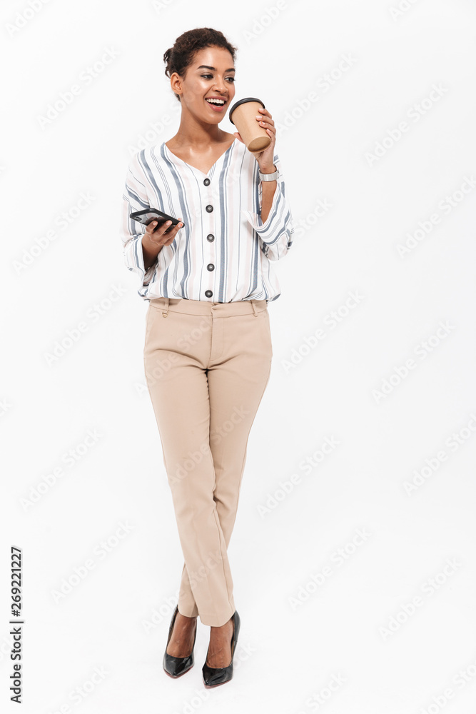 Full length portrait of a smiling young african businesswoman Full length portrait of a smiling young african businesswoman