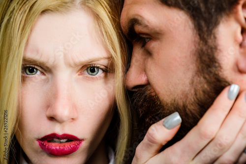 Couple in love. Beautiful woman touch beard of man. Love, care, tenderness. Girl with makeup touching face of bearded man. Beautiful couple in tender passion. Romantic relationships. Intimacy concept.