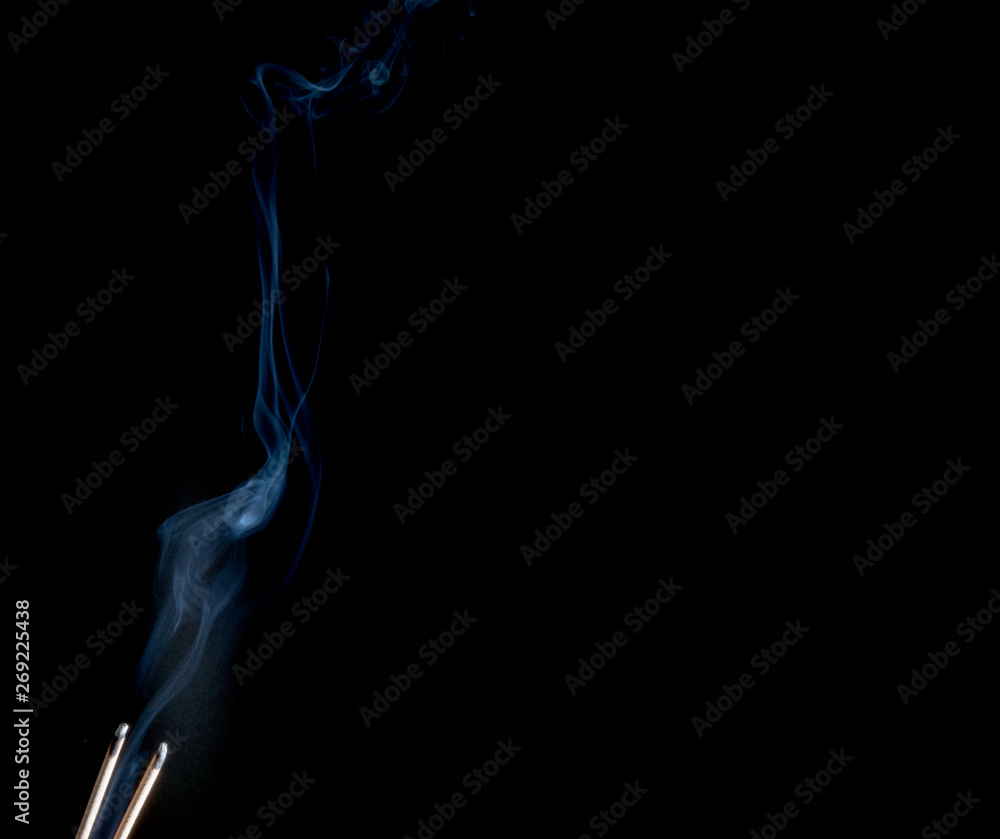 Abstract smoke of joss stickon black background Abstract smoke of joss stickon black background