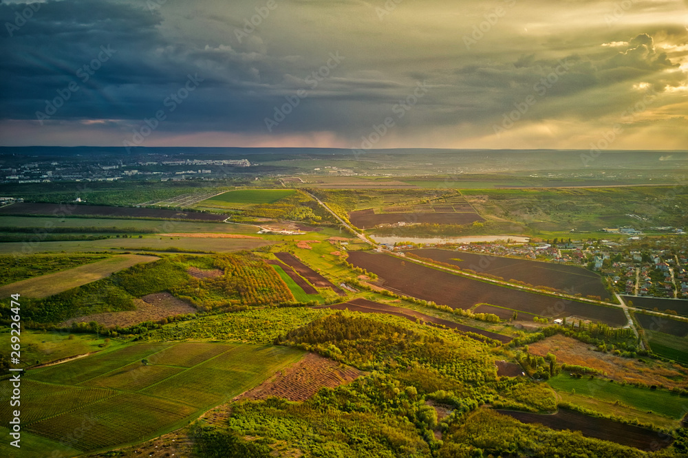 Flight over cultivating field in the spring at sunset. Moldova Republic of.