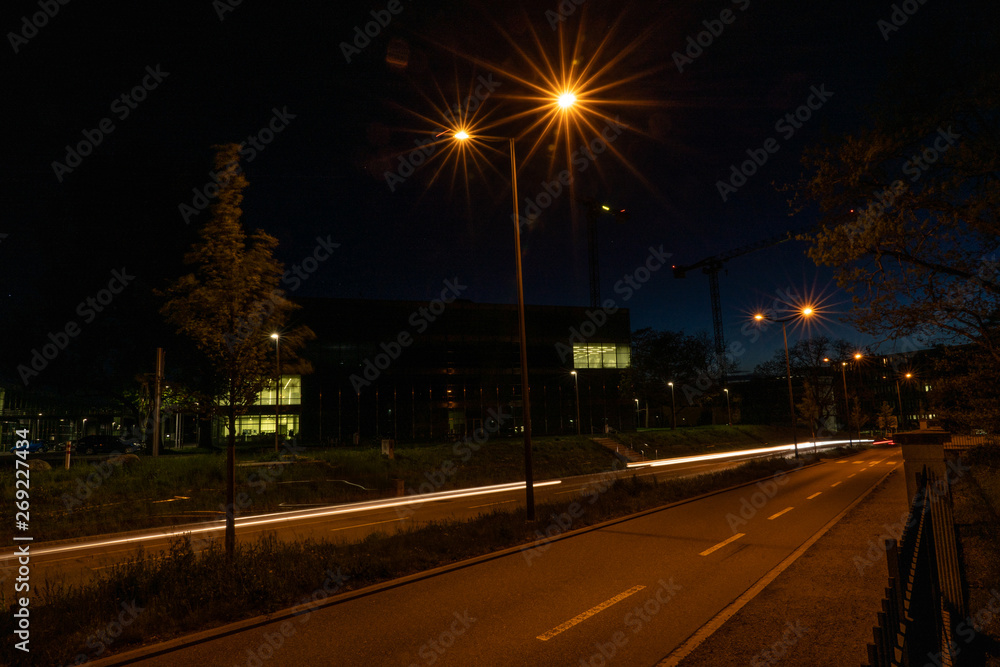 Enlighted street near Campus FHNW Brugg Switzerland by night. No cars.