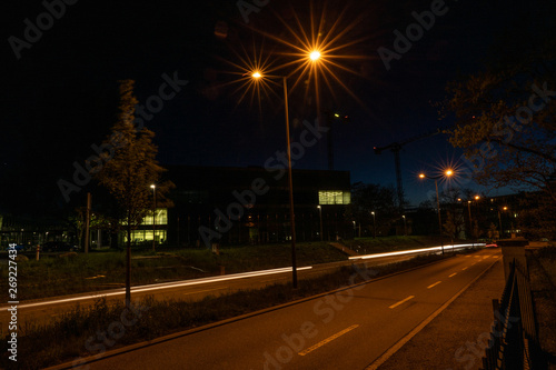 Enlighted street near Campus FHNW Brugg Switzerland by night. No cars. © Claudine