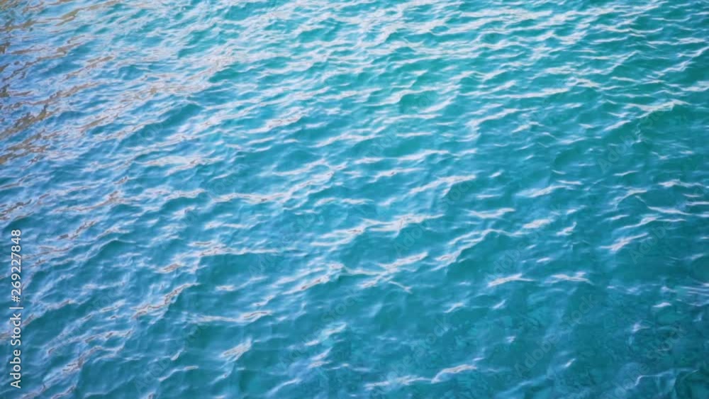 Close up of disturbed blue ocean water surface. Slow motion Close up of disturbed blue ocean water surface. Slow motion