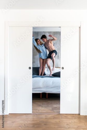 Couple having jumping on bed © DavidPrado