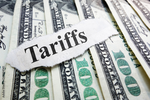 Tariffs newspaper headline on money