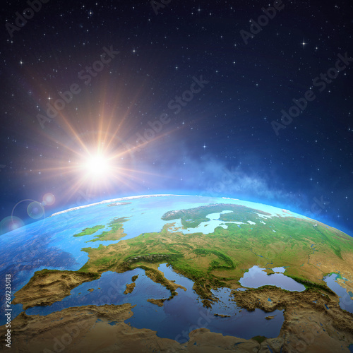 Fototapeta Naklejka Na Ścianę i Meble -  Sun shining over the Earth from space