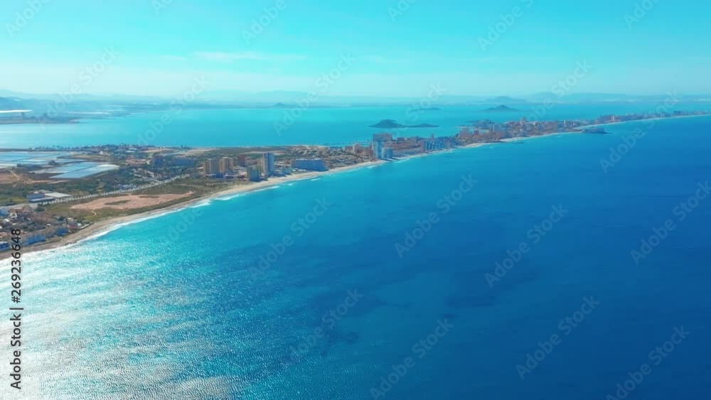 Aerial view. A picturesque looking view of a long sand spit La-Manga, Spain. Aerial view. A picturesque looking view of a long sand spit La-Manga, Spain.