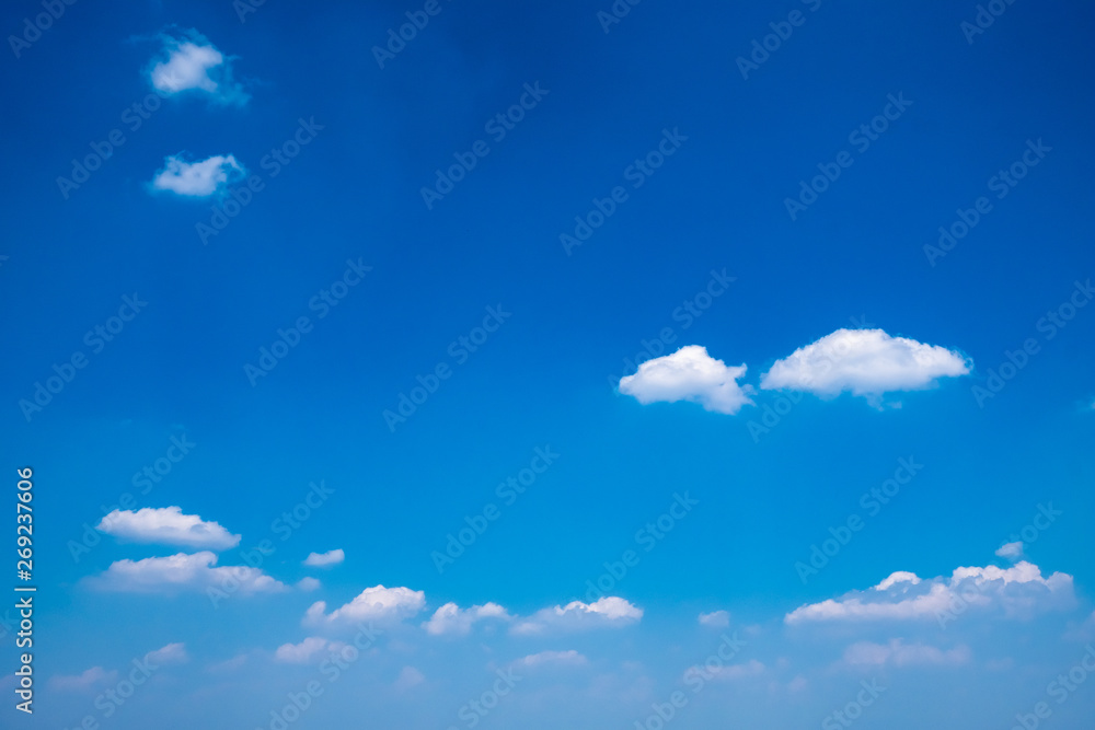 Beautiful clear blue sky with white fluffy clouds on a sunny day. Beautiful clear blue sky with white fluffy clouds on a sunny day.