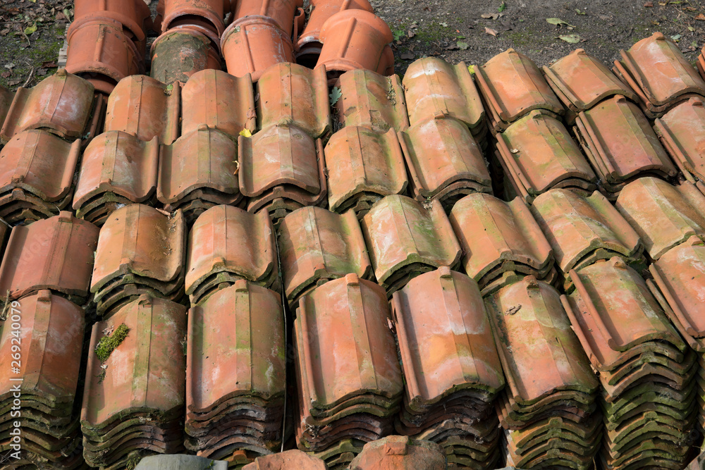 heap of old and new roof tiles heap of old and new roof tiles