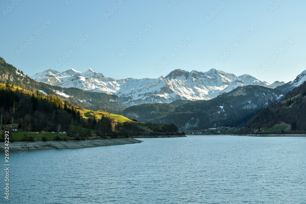 Beautiful view on Bernese Alps behind the Lungernersee lake near Lungern