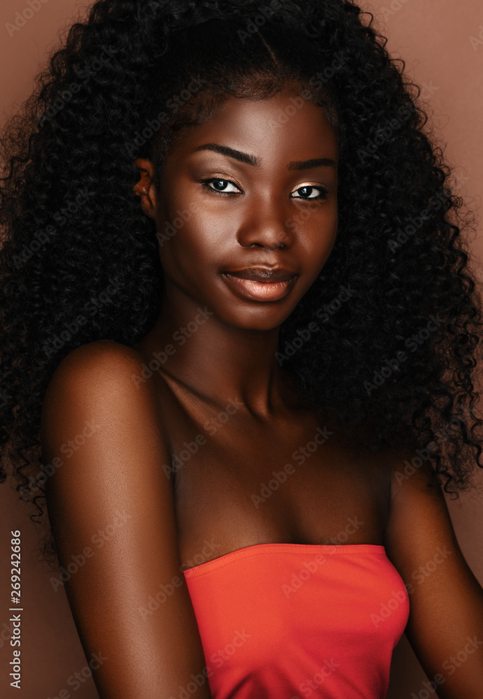 Brunette curly haired young model with dark skin and perfect smile.African  beautiful woman portrait. Stock Photo | Adobe Stock
