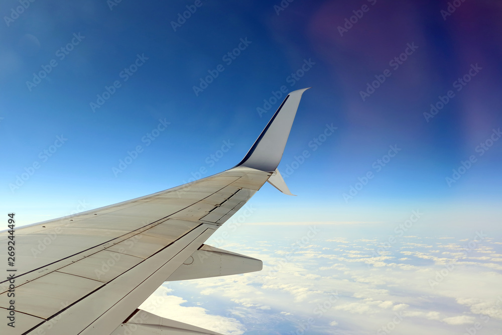 airplane wing through the porthole airplane wing through the porthole