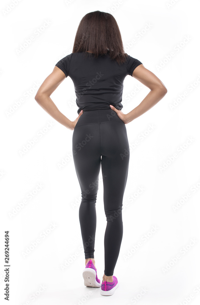 back view of young black woman in sportswear on white background. back view of young black woman in sportswear on white background.