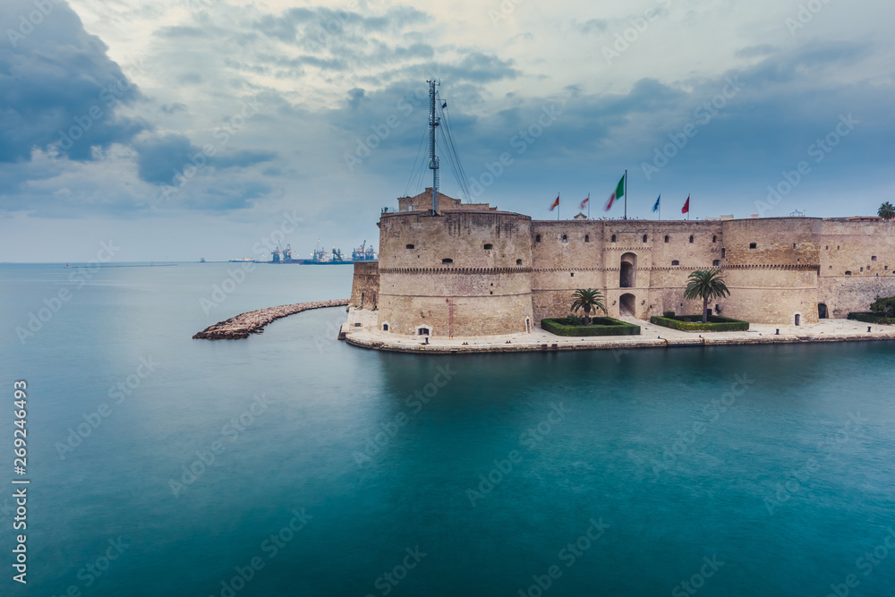 Aragonese Castle of Taranto and revolving bridge on the channel between Big and Small sea. Puglia, Italy.