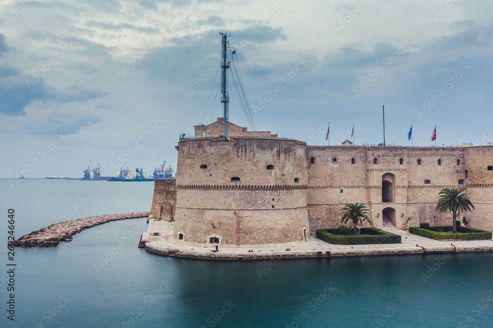 Aragonese Castle of Taranto and revolving bridge on the channel between Big and Small sea. Puglia, Italy.