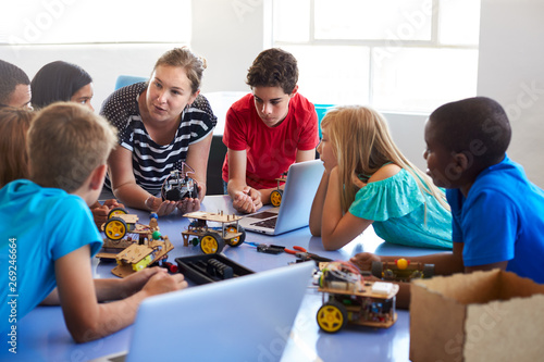 Students In After School Computer Coding Class Building And Learning To Program Robot Vehicle