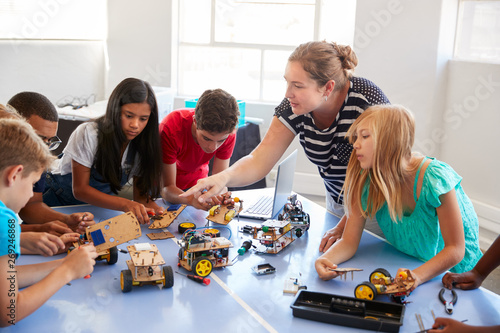 Students In After School Computer Coding Class Building And Learning To Program Robot Vehicle photo