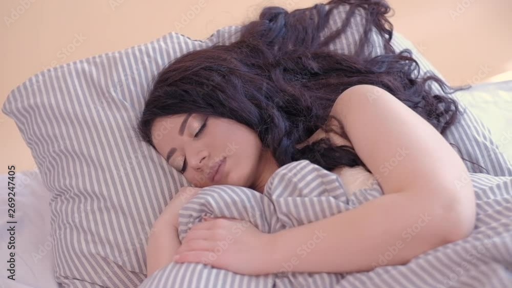 Troubled sleep. Anxious thoughts. Tired woman trying to have a nap, get rest in cozy bed at home. Troubled sleep. Anxious thoughts. Tired woman trying to have a nap, get rest in cozy bed at home.